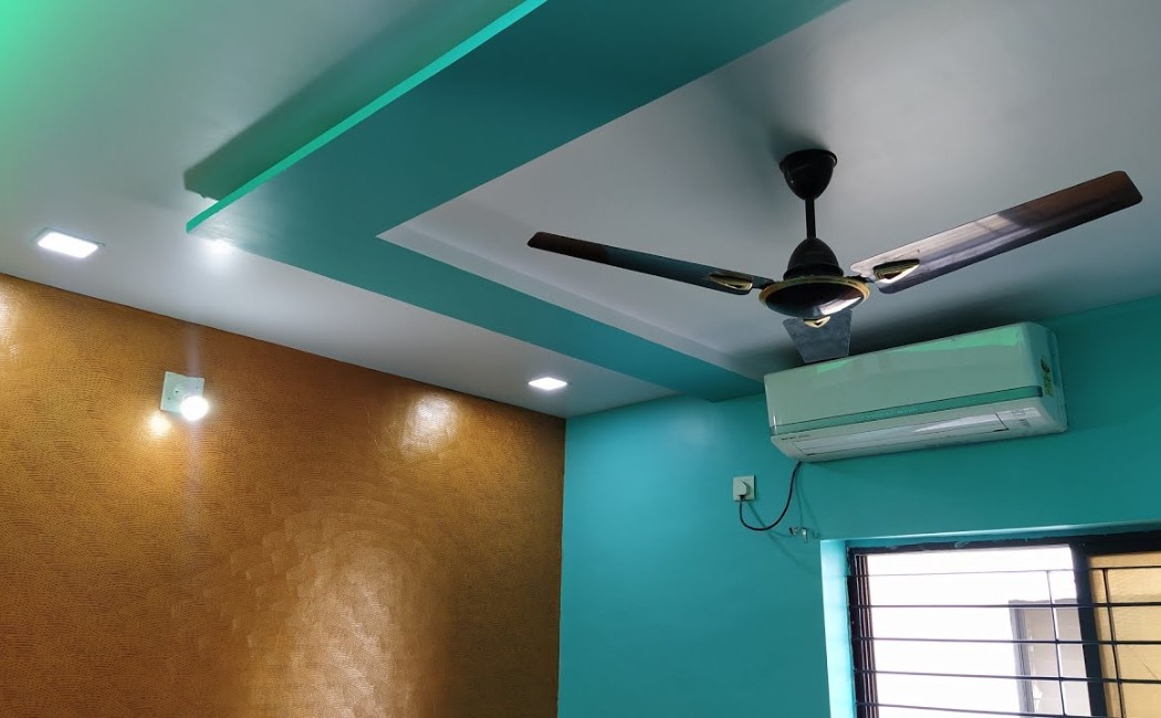 Interior painting project featuring modern ceiling accents, textured walls, and vibrant room color finishes.